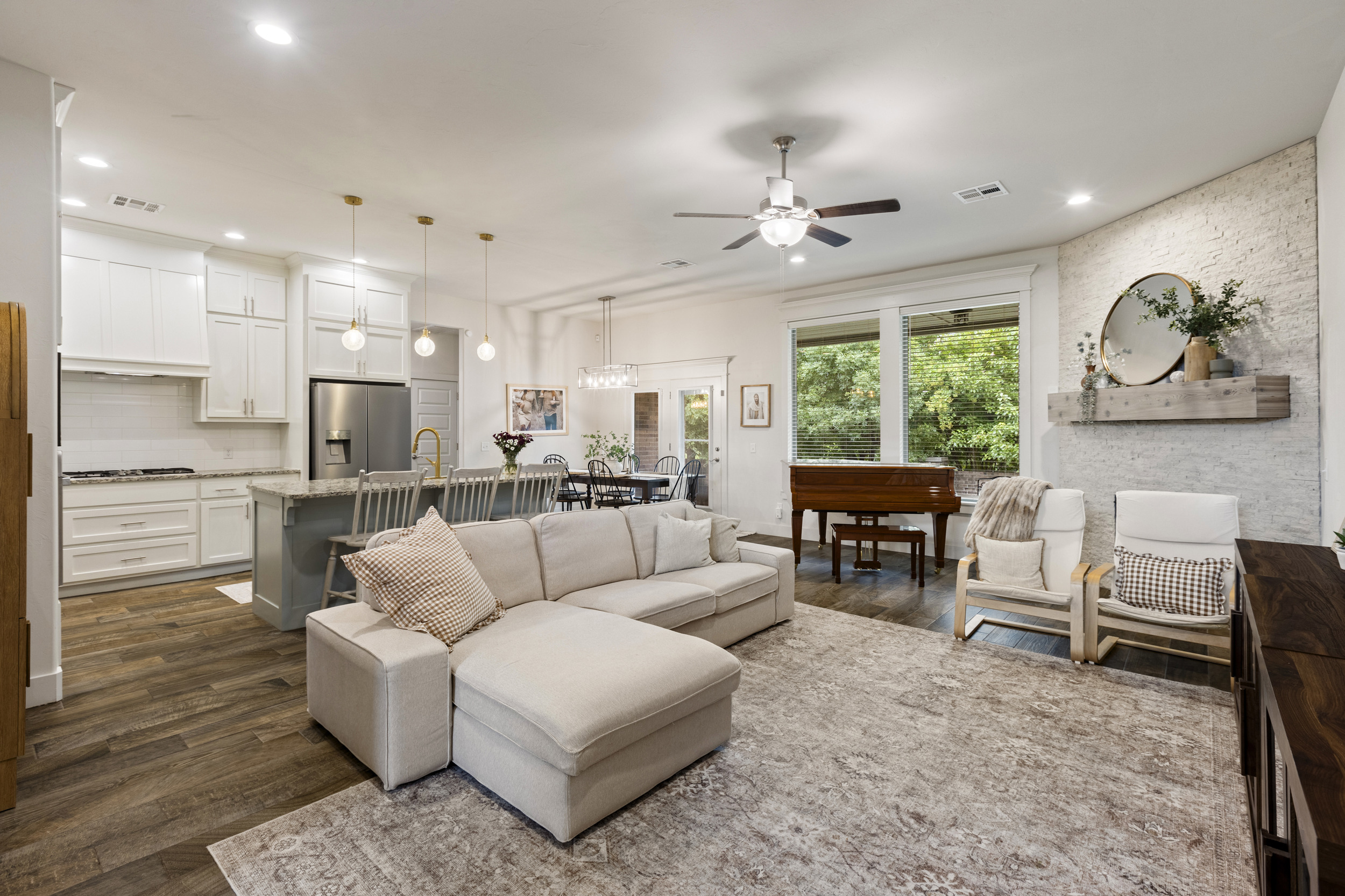 Staged living room with a piano